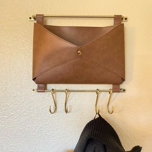 Hanging mail slot with hooks for jackets